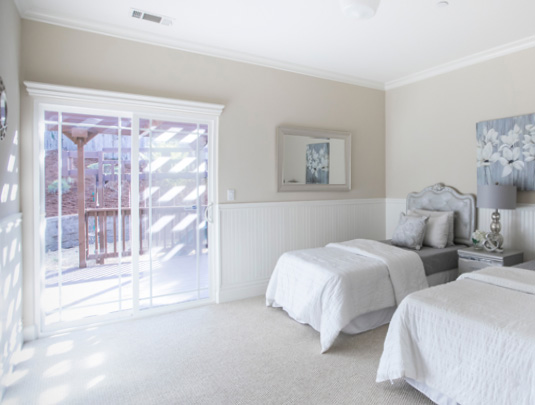 Bedroom with 2 beds and light colour scheme